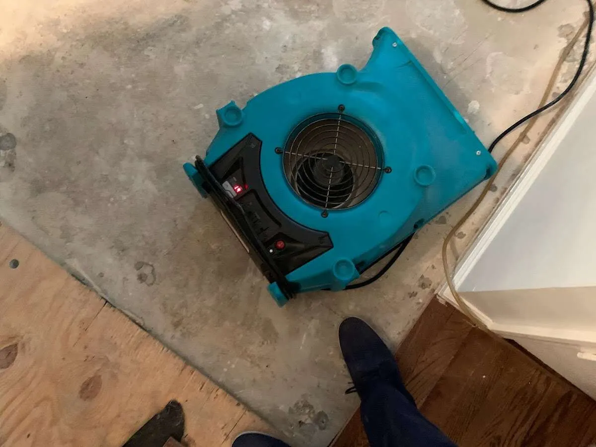 Air mover drying subfloor during Leak Detection & Repair in Waianae